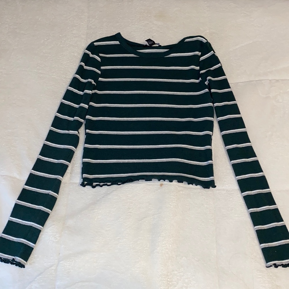 Green white and grey striped shirt that’s ruffled at the sleeves and bottom 💚